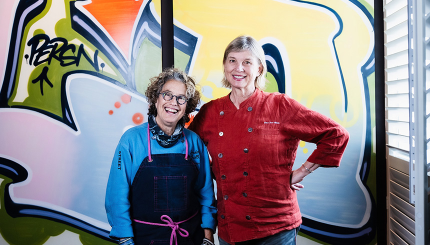 Chefs Susan Feniger and Mary Sue Milliken at Socalo Santa Monica that features street art by Clark Oswald. Photo by East West Bank.